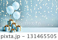 Festive scene featuring blue balloons floating above beautifully wrapped gifts adorned with golden accents, creating a joyful atmosphere for celebrations and special occasions 131465505