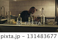 An alcoholic argues on the phone in the kitchen 131483677
