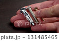Choosing of fastener type for repair. Bolt, anchor and screw in a repairman hand close up 131485465