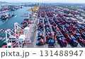 Aerial top view hyperlapse container cargo ship international port terminal with gantry crane, industrial cargo container port loading and unloading, Global business logistic import export. 131488947