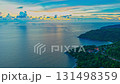Time lapse Twilight Serenity at Kata beach Phuket. Soft hues of orange, pink, and violet spread across the evening sky, merging with the calm sea in a breathtaking panorama of tropical beauty. 131498359