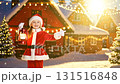 Happy European girl child in Santa costume holding vintage lantern at illuminated Christmas village with snow falling and festive lights 131516848