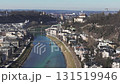 Aerial view of Salzburg, Austria, featuring the Salzburg Cathedral, Salzach River, bridges, and surrounding hills with smooth panning motion. 131519946
