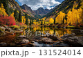 A valley landscape of mountains dyed in autumn leaves and yellow leaves and coniferous trees reflected on the lake surface 131524014