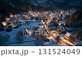 Night view of lit houses in a snow-covered mountain village 131524049