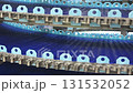 Observation of a conveyor belt system transporting blue components in a manufacturing facility 131532052