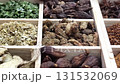 Exploring the vibrant world of herbs and spices in a local market filled with diverse aromas and colorful ingredients 131532069