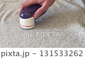 lint remover buzzing when shaving cotton fabric 131533262