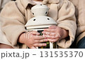 Child Holding Lantern with Autumn Leaves 131535370