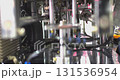Industrial robotic arm handling metal sheet in factory 131536954