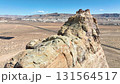 Aerial Desert Cliff Fly Through Forward Over Sandstone Formation and Road 131564517