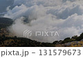 Time lapse: drifting clouds and occasional paraglider at Babadag summit 131579673