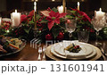 Elegant christmas dinner table setting with roasted meat, poinsettias, and lit candles 131601941