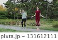 Jump rope training session in a park 131612111