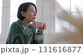Middle-aged woman relaxing with coffee 131616877