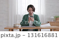 Middle woman operating a smartphone 131616881
