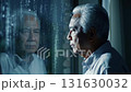 An elderly man stands alone at the window of an old house. 131630032