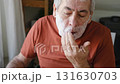 Senior Man shaving his face. Old male shaves beard and mustache with shaver. Elderly gray haired man looking at the mirror, applies shaving cream foam and using razor. Skin hygiene. Daily body care 131630703