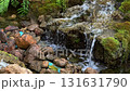slow motion of small waterfall in the garden daytime 131631790