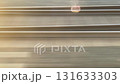 High-speed view of railway tracks in motion blur, captured from a moving train. Dynamic transportation background with lines in motion and earthy tones. 131633303