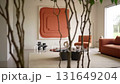 Modern living room interior with abstract terracotta art and contemporary furniture 131649204