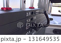 Footage shows a vertical gym weight stack with labeled plates reaching up to 52.5 pounds under bright lighting. 131649535
