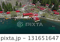 Aerial view of a picturesque lakeside resort in Pakistan, featuring traditional architecture and stunning natural surroundings 131651647