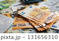 Background with US Dollar and Euro bills, BTC bitcoins and bills to pay. 131656310