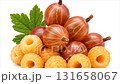 A colorful collection of fresh gooseberries and raspberries arranged attractively, showcasing their natural textures and inviting hues just in time for summer recipes. 131658067