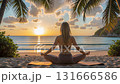 Time lapse of sunrise beach yoga meditation session with calm ocean waves. 131666586