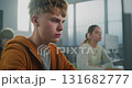 Handsome Student Works on Developing Game in Classroom 131682777