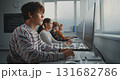 Male Student Working on Game Development Task in Classroom 131682786