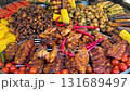 Assorted grilled meat and vegetables on barbecue grill 131689497