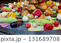 Colorful assortment of bread and fresh garden vegetables 131689708