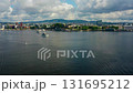 Drone Zoom-In of Ferry Entering Oslofjord with Oslo Skyline in Summer Light 131695212
