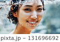 A woman looking at you underwater and smiling 131696692