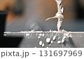 Pan scene the drilling process the metal plate on NC milling machine with liquid coolant method. The high precision parts production on milling machine. 131697969
