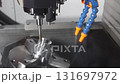 Slow motion scene the 5-axis CNC milling machine finish cut the mold part with solid ball nose end mill tool. The hi-technology automotive part manufacturing process by multi-axis CNC milling. 131697972