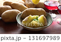 Put melted cheese on boiled potatoes 131697989