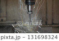 The CNC milling machine finishing cut the injection mold parts with oil coolant method. The mold and die manufacturing process by CNC machining center. 131698324