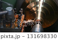 Pan scene the lathe machine finish cut the brass material parts. The metalworking process by turning machine. 131698330