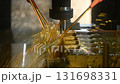 The CNC milling machine finishing cut the mold parts by solid ball nose end mill tool with oil coolant method. The mold and die manufacturing process by CNC machining center. 131698331