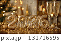 Celebration setup with golden numbers and champagne glasses for New Year 2026 131716595