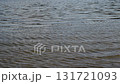Slow motion capture of rippling water surface with reflections during tranquil afternoon at the lake 131721093