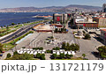 Aerial view of Izmir Clock Tower and Konak Square with coastline, buildings, and blue sea on a sunny day in Turkey. 131721179