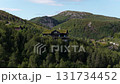 Aerial shot of a traditional norwegian turf roof house in the mountains 131734452