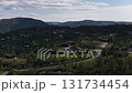 Aerial view of traditional norwegian turf roof houses in a mountain forest 131734454