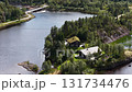 Aerial drone view flying over lake cabin surrounded by forest 131734476