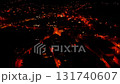 The captivating aerial view at night beautifully showcases the glowing streets and buildings of an orangelit city 131740607