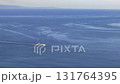 Aerial view of a single white boat crossing the blue sea Aerial view of a single white boat crossing the blue sea 131764395